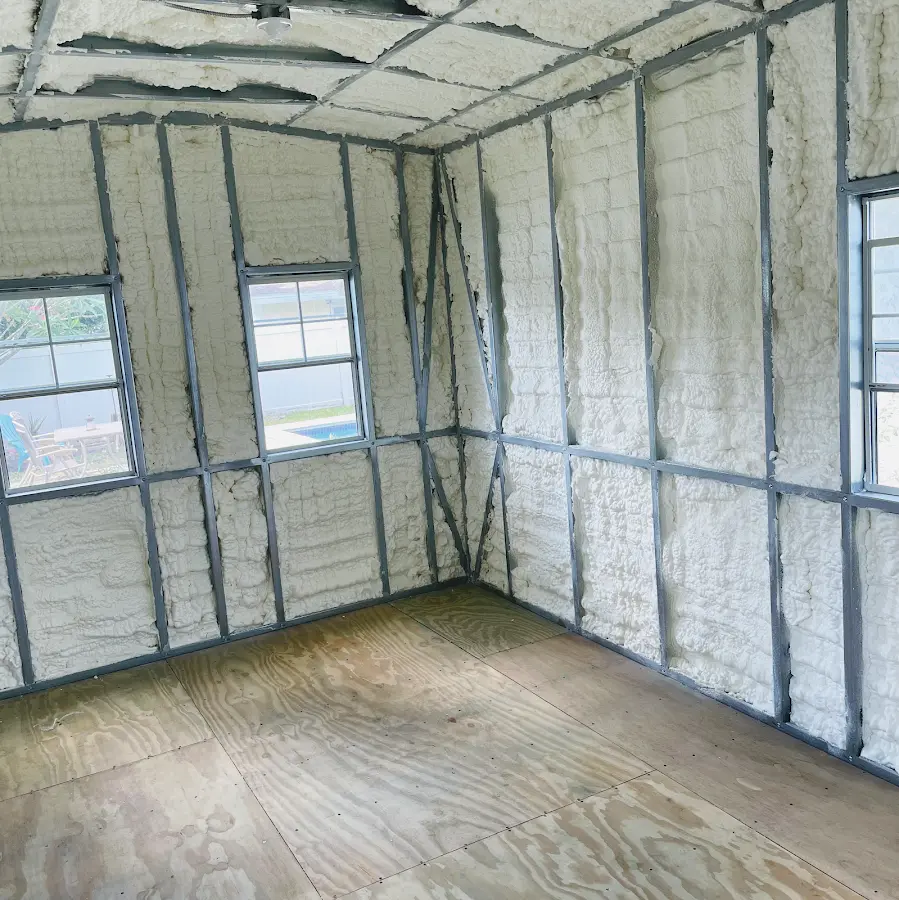 Closed-cell spray foam insulation applied to wall cavities in a residential project in Davie